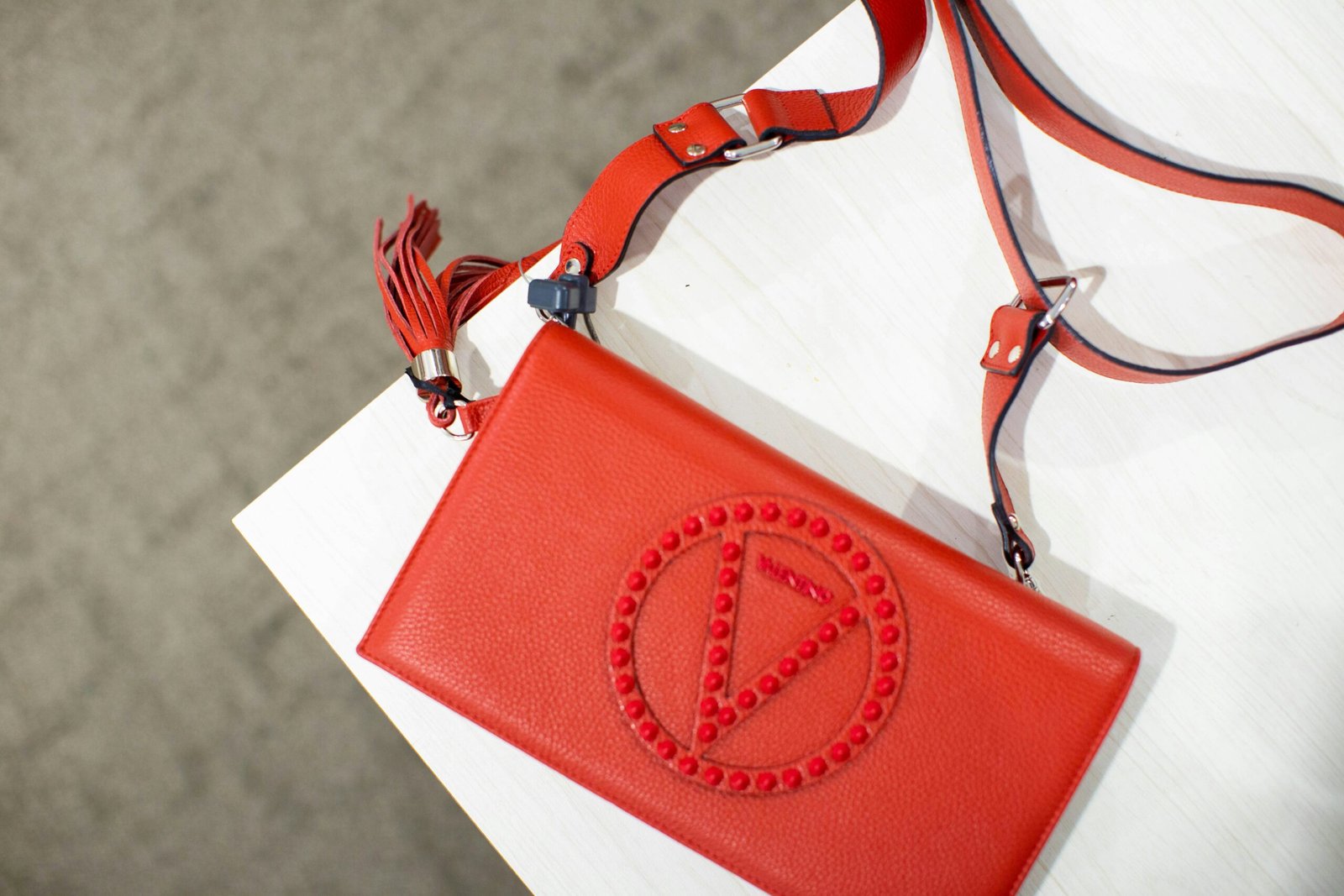 red and white sling bag